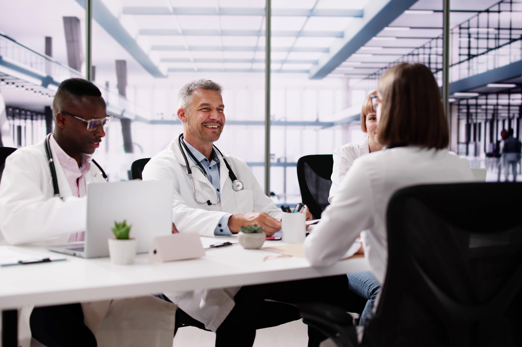 Medical professionals collaborating at a desk