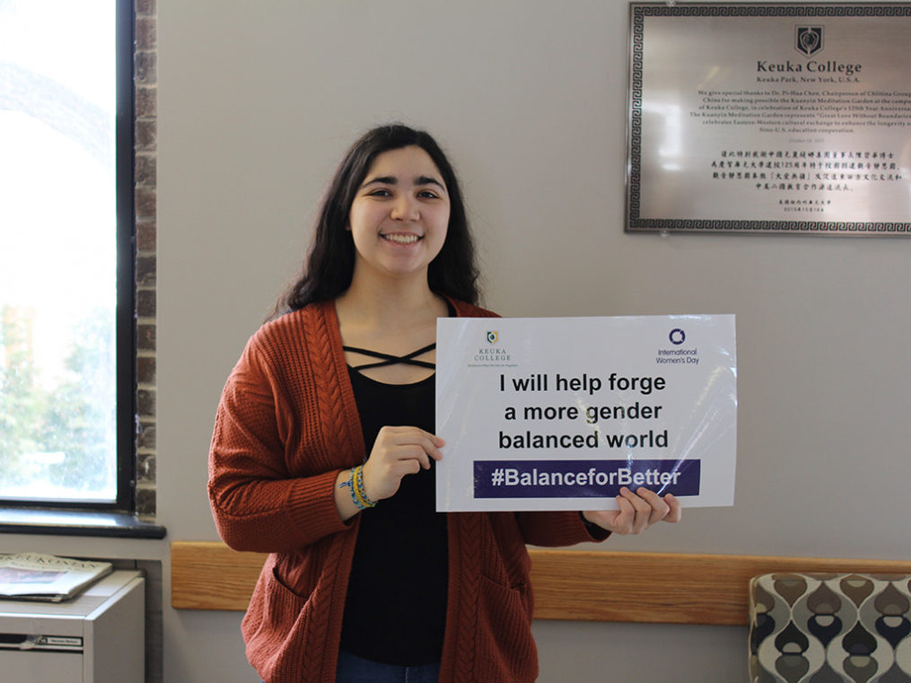 Keuka College students, faculty, staff, and supporters commemorated International Women's Day on Friday, March 8, by taking photos with “selfie cards” proclaiming strategies for progress.