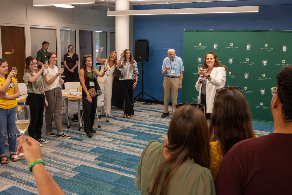 Provost and Vice President for Academic Affairs Dr. Heather Maldonado toasts Professor Emeritus of Occupational Therapy Dr. Peter Talty and the entire department during a 40th anniversary celebration held on Sept. 27 in the lower level of Lightner Library.