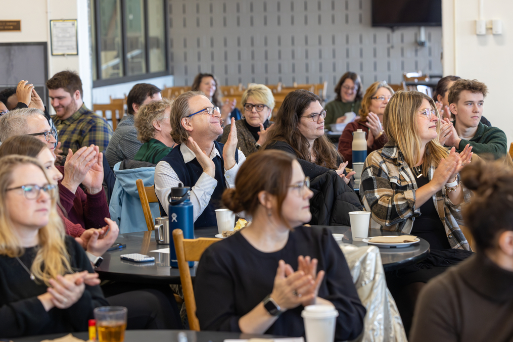 Some 150 faculty and staff attended the Community Day presentation, including College Chaplain Eric Detar, show at center.