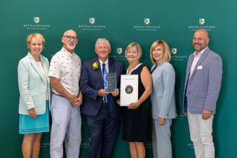 The 2025 Donald and Corrine Stork Award for Community Service winners, Stacy and Chris Wyant, center, pose with, from left, Peggy Stork Havens and Steve Stork (Donald and Corrine Stork's children), Keuka College President Amy Storey, and College Workforce Development Specialist Steve Griffin.